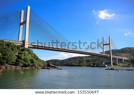 the suspension bridge, Tsing Ma Bridge crossing between the islands and the blue sky in hong kong suburb