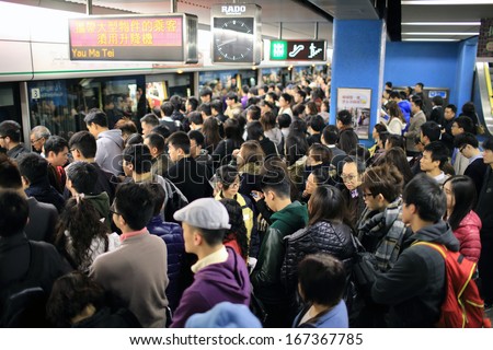 HONG KONG, NOVEMBER 29: crowd of passengers are waiting in Kowloon Tong station on 29 nov 2014. The crowd because the signal failure and transport accident again in MTR subway