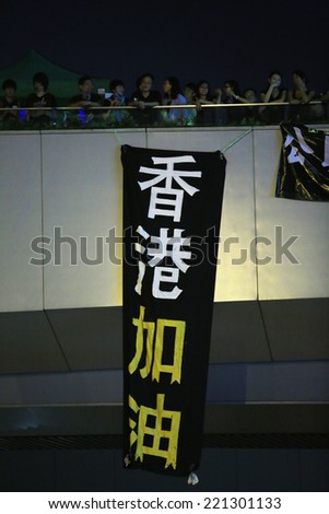 HONG KONG,OCT.1: protesters show banner ' keep going on, hk