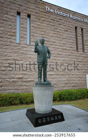 OSAKA,JAPAN; OCT 21: Momofuku Ando statue is in front of Instant Ramen Museum in osaka on 21 october 2014.it is a museum dedicated to instant noodles and Cup Noodles, as its founder, Momofuku Ando