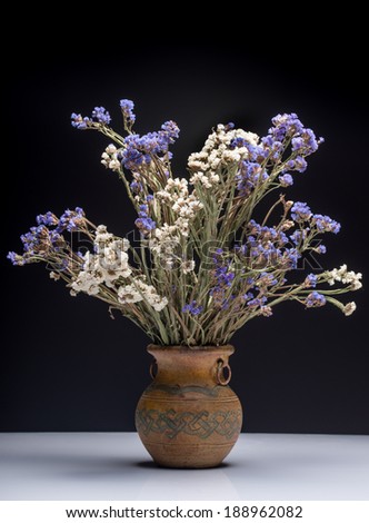 Bouquet of flowers in old vase