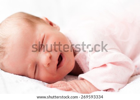 new born baby sleeping on texture blanket, lying on blanket, closed eyes, light pink dress