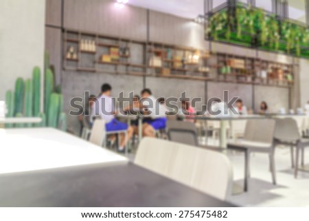 blur background : View of restaurant with people eating.