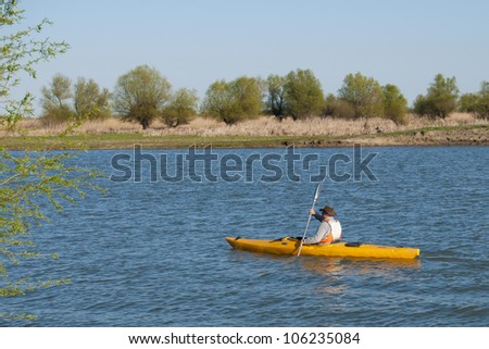 Man paddling in Kayak in Danube Delta