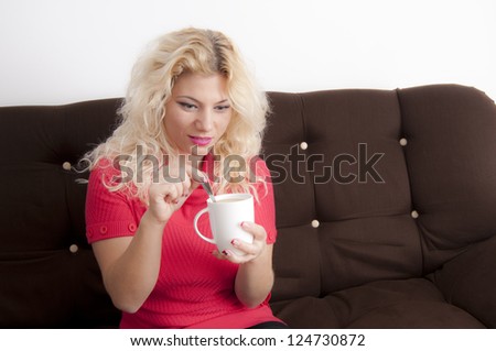 Young Blonde Woman with a coffe mug