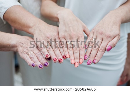 Close-up of female hands several generations of a family