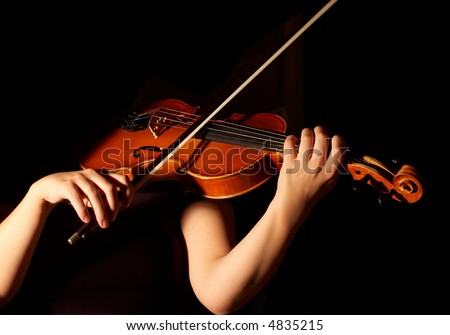 musician playing violin isolated on black