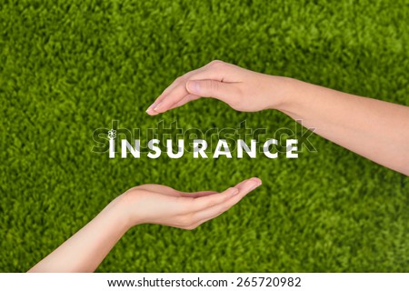 Two Woman\'s open hands making a protection gesture with Insurance inscription  isolated on green background.Family life insurance, protecting family, family concepts.
