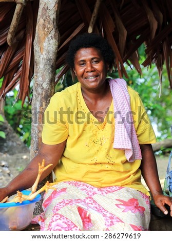AMBRYM,VANUATU-OCTOBER 11, 2014: Local woman prepares dinner for foreign guests on October 11, in Ambrym-Vanuatu.
