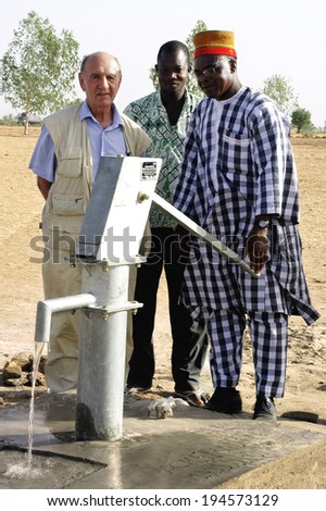 LIGUIDIMALGEM, BURKINA FASO - FEBRUARY 27: pump in Burkina Faso. The leaders of the association and the village chief inaugurate all the new pump, February 27, 2007