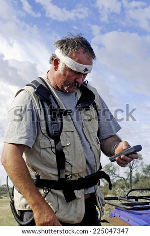 AUSTRALIA - MAY 6: Gold miner in Australia including updates its GPS to ensure a safe return to its starting point safely, may 6, 2007.