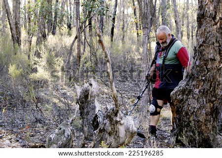 AUSTRALIA - APRIL 23: Gold miner at work detecting gold nuggets with a metal detector, April 23, 2007