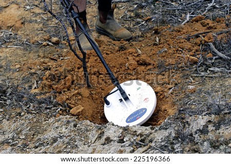 AUSTRALIA - APRIL 24: Gold miner at work detecting gold nuggets with a metal detector, April 24, 2007