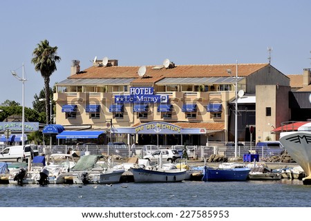 GRAU-DU-ROI, FRANCE - SEPTEMBER 1: A hotel and a restaurant bar in Grau-du-Roi located on the harbor in downtown, september 1, 2014.