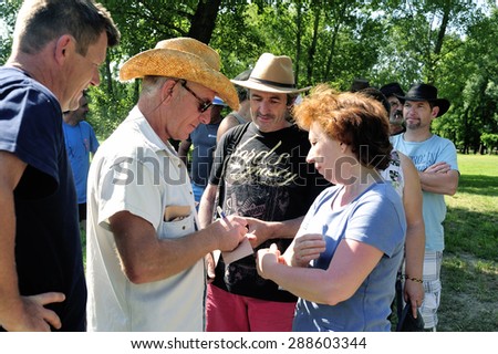 CARDET, FRANCE - MAY 25: Treasure hunt organized in a French campsite to amuse and occupy campers. Participants must find the envelopes containing the indices. Verification of answers, may 25, 2015.