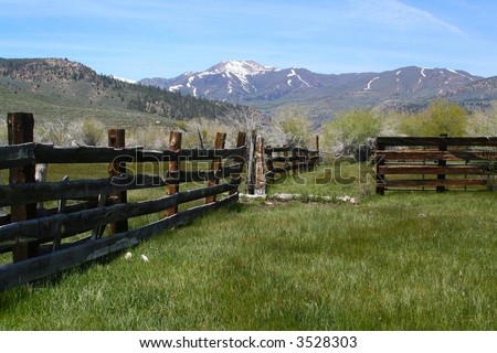Taken in the Sierras - a rustic, old, abandoned farm and pasture. Rich with old wood fence and overgrown grass.