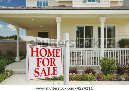 Home For Sale Sign in Front of Beautiful Lakefront New Home