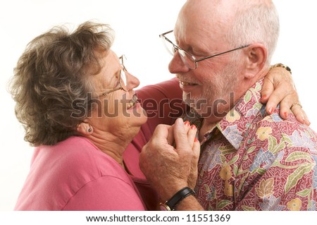 Happy Senior Couple romantically dancing.