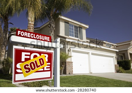 Red Foreclosure For Sale Real Estate Sign in Front of House.