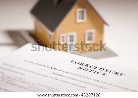 Foreclosure Notice and Model Home on Gradated Background with Selective Focus.