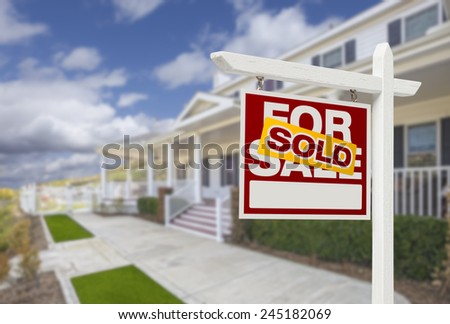 Sold Home For Sale Real Estate Sign and Beautiful New House.