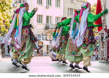 PLOVDIV, BULGARIA - AUGUST 06, 2015 - 21-st international folklore festival in Plovdiv, Bulgaria. The folklore group from Turkey dressed in traditional clothing is preforming Turkish national dances.