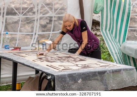 PLOVDIV, BULGARIA - SEPTEMBER 26, 2015 - Autumn Crafts Fair in the Old Town of Plovdiv, Bulgaria. The fair includes activities like wool felting, pottery, wood carving, painting and many more.