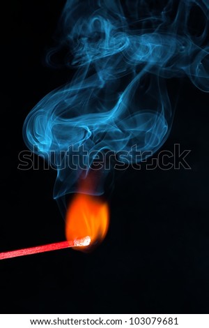 a burning match with smoke coming out