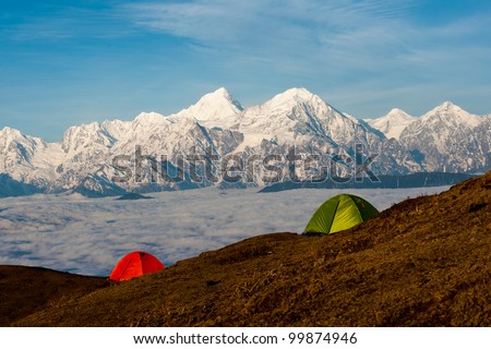 tents in front of snow mountain