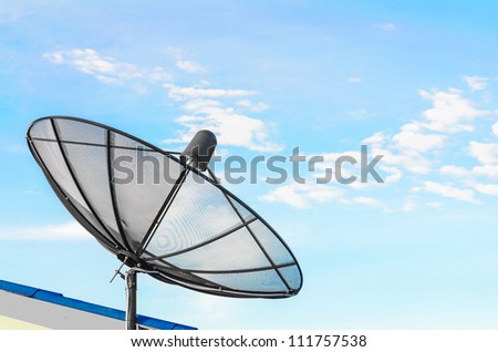 communication satellite dish over blue sky