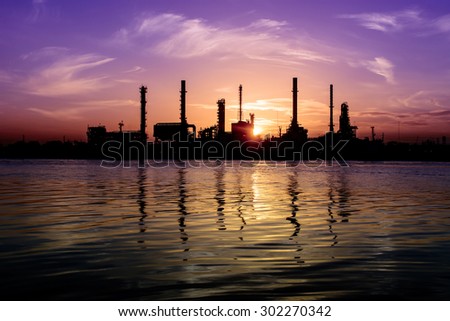 Oil refinery factory over sunrise Bangkok Thailand,Oil refinery with silhouette
