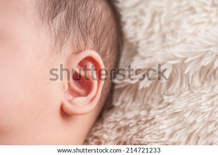 close up of newborn baby ear, showing close up of ear and side of babies head