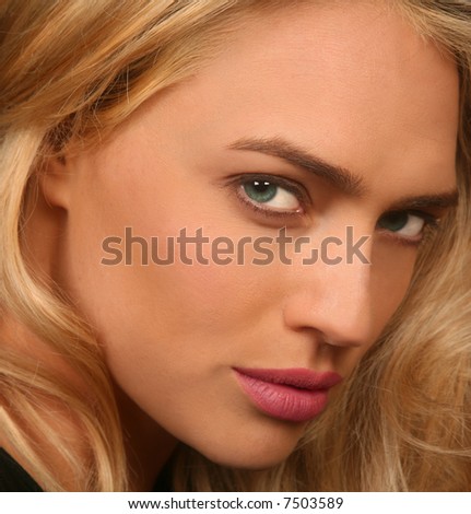Side facial view of a Beautiful female with green eyes