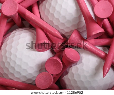 Pink Golf Tees set on white Golf Balls