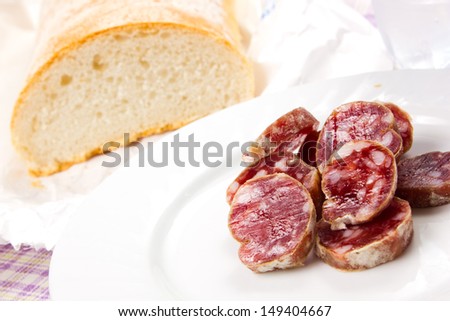Italian salami with bread on the table