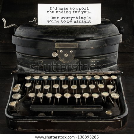 Old antique black vintage typewriter and paper with text telling everthing is going to be alright - concept for optimism, comfort and trust for the future