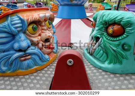 Images of evil characters at the booths in the park carousel