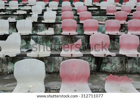 Vandals broken plastic seats in the stands of the football stadium