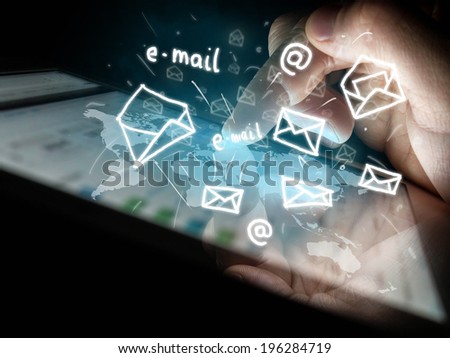 digital tablet in hand and sending e-mails