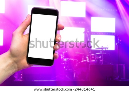 concert and mobile device in the hands of women