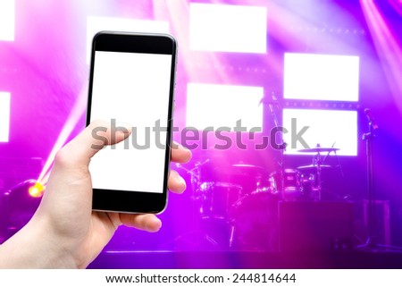 concert and mobile device in the hands of women