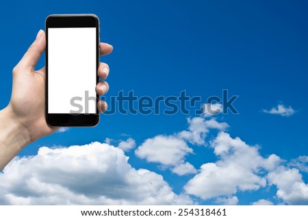 phone in the hand with a blank screen on a background of the sky