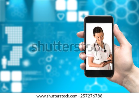 Phone in her hand and a doctor online
