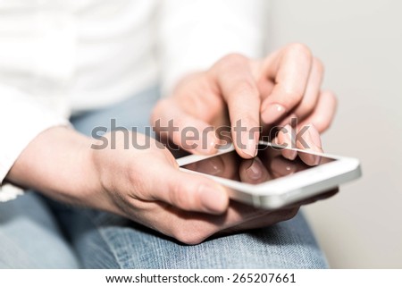 phone in the hands of a woman
