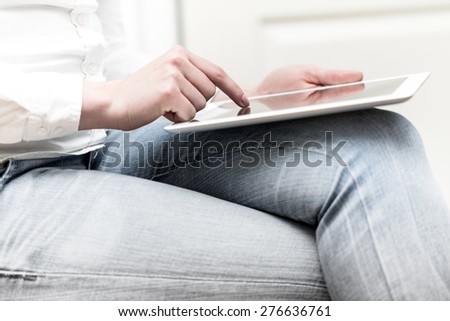 Woman writes on the tablet