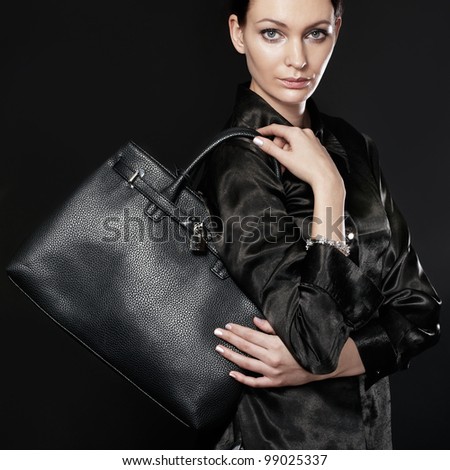 Beautiful woman with black bag
