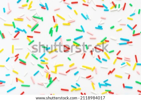 flat lay of colorful sprinkles over white background, festive decoration for banner, poster, flyer, card, postcard, cover, brochure, designers Stock foto © 
