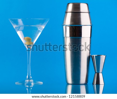Dry Martini, Shaker and Measure glass over colorful blue background