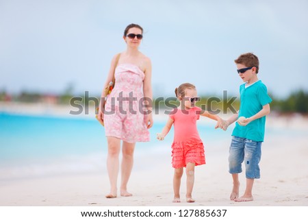 Mother and two kids on a tropical beach vacation