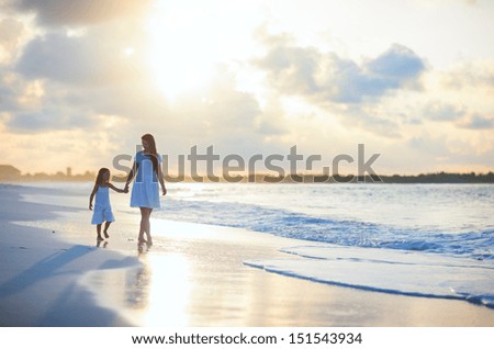 Similar – Image, Stock Photo Coastal landscape and girl in yellow hooded coat looking at sea and walking. Copy space.